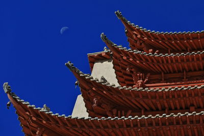 Low angle view of temple against blue sky