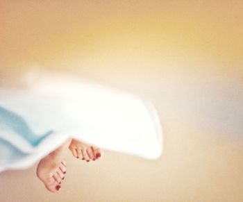 Low section of woman lying on floor