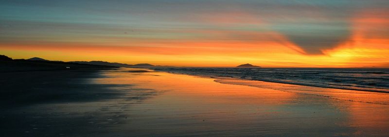 Scenic view of sea at sunset