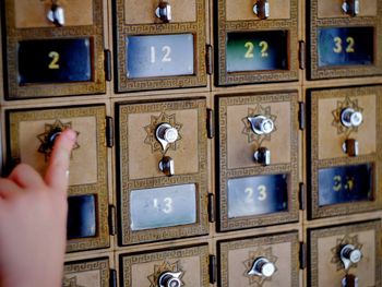 Cropped image of hand using combination lock