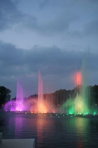 Reflection of illuminated buildings in water