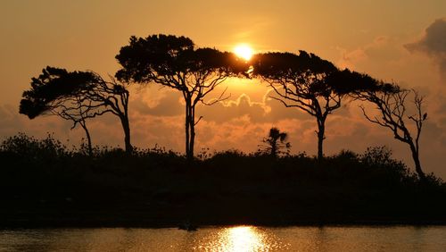 Scenic view of sunset over river