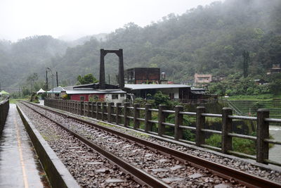 Train on railroad track against sky