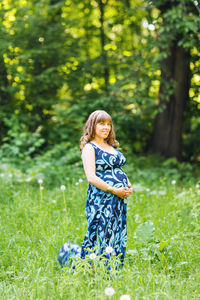 Full length of girl standing on field