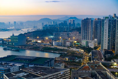 High angle view of illuminated buildings in city against sky