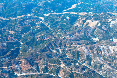 Flight over the mountain hills .  view of mountains covered by forest . highlands of switzerland