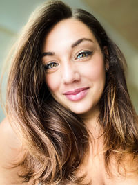 Close-up portrait of a smiling young woman