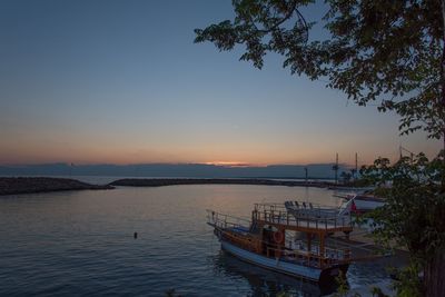 Scenic view of sea against clear sky during sunset