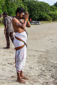 Rear view of man standing on land