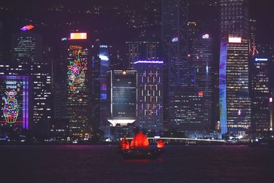 Illuminated buildings in city at night