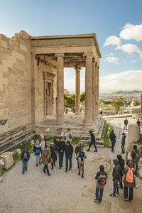 Group of people in front of historical building