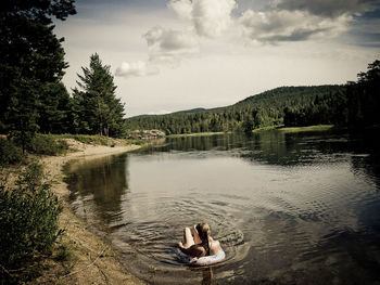 Low section of woman in lake