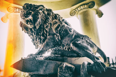 Low angle view of statue against temple