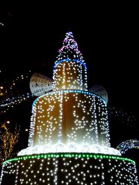 Low angle view of illuminated christmas tree