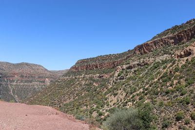 Scenic view of mountains against clear blue sky