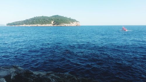 Scenic view of sea against clear sky