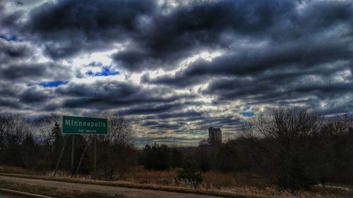 Scenic view of landscape against cloudy sky