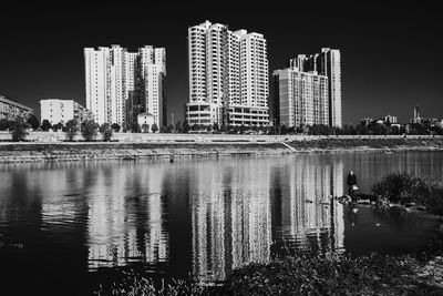 Reflection of buildings in city at night