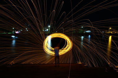 Light trails against sky at night