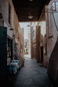 Empty alley amidst buildings