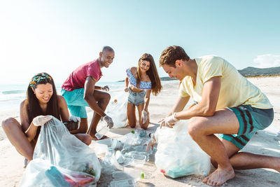 Activist picking garbage at beach