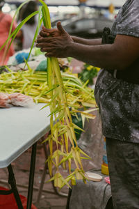 Coconut leaves hang for sale in conjuction of deepavali celebration at the market.