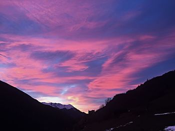 Scenic view of mountains at sunset