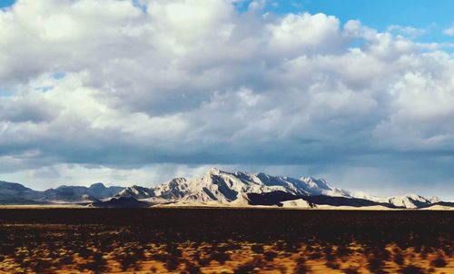 Scenic view of snowcapped mountains against sky