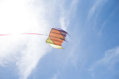 Low angle view of kite flying against sky