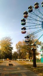 Low angle view of ferris wheel against sky