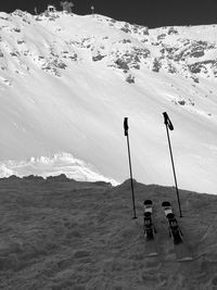 Winter sport equipment on snow against sky