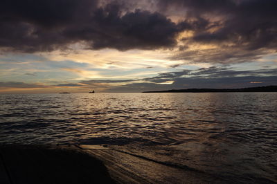 Scenic view of sea against sky at sunset