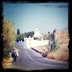 Woman walking on road