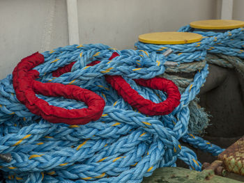 Close-up of rope tied on bollard