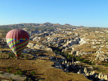 View of mountain range against clear blue sky