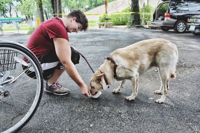 Man with dog sitting on bicycle