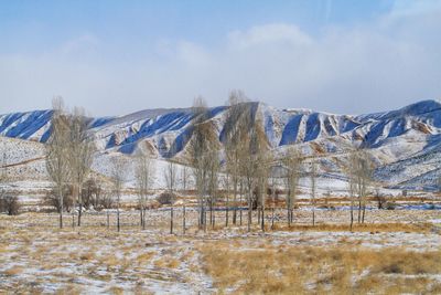 Scenic view of snowcapped mountains against sky