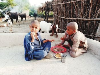 Rear view of people eating food