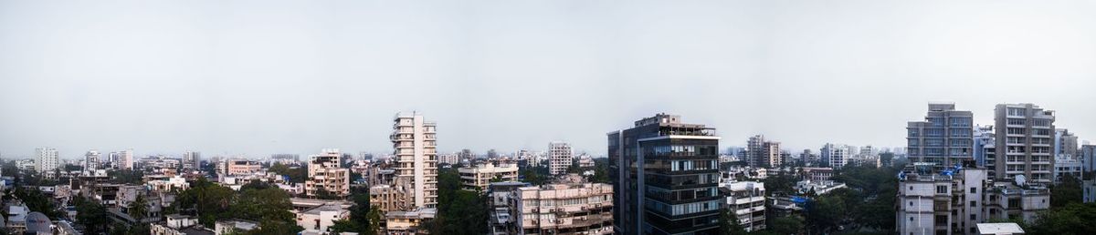 Panoramic view of cityscape against clear sky