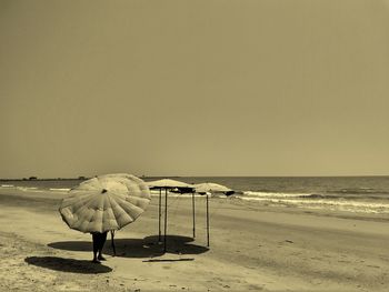 Scenic view of beach against clear sky