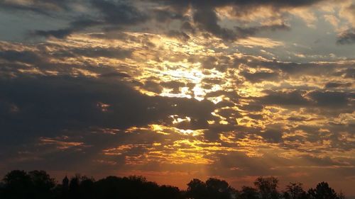 Low angle view of dramatic sky during sunset