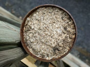 High angle view of rusty metal on wood