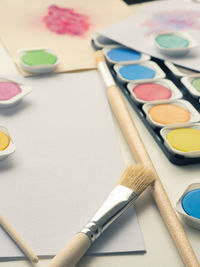 High angle view of paintbrushes on table