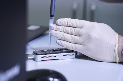 Close-up of hand holding medical instruments