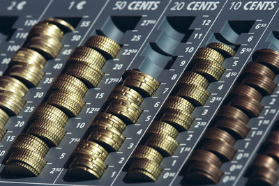 Close-up of coins on container