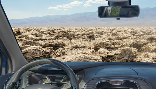 Looking through a car windshield with view of devil's golf course, death valley, usa