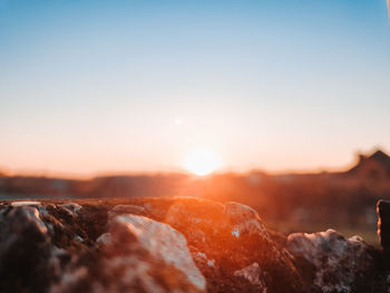 Scenic view of rocks against sky during sunset