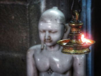 Close-up of buddha statue in temple