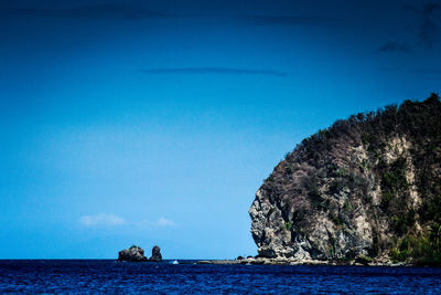 Scenic view of sea against clear blue sky