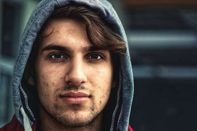 Close-up portrait of smiling young man